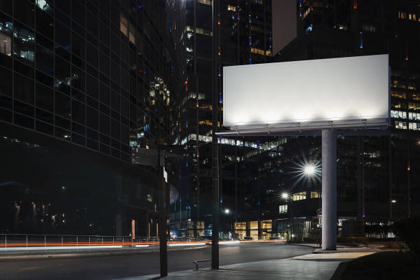 istock Blank billboard at night time with the city on background. 3d rendering 1003112004