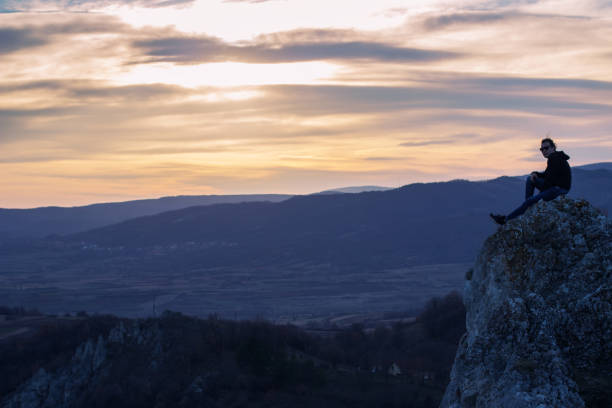 istock Man on top of the mountain 1003112012