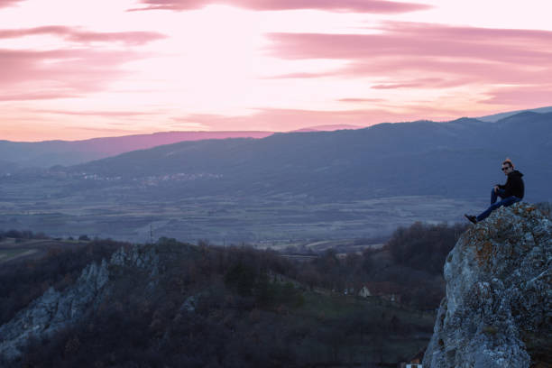 istock Man on top of the mountain 1003114438