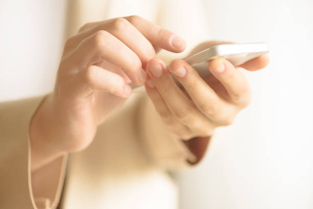 istock Businesswomen hand using smartphone on blur abstract background. Business, study, remote work, always connect concept. Сellphone in lifestyle 1003115026