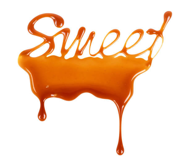 The word Sweet written by liquid caramel on white background