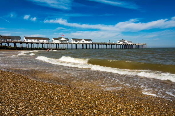 Felixstowe pier extending over the tranquil sea on a cloudy day