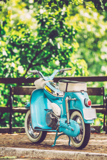 istock Old-fashioned Motor Scooter Parked in a City Street 1003127516