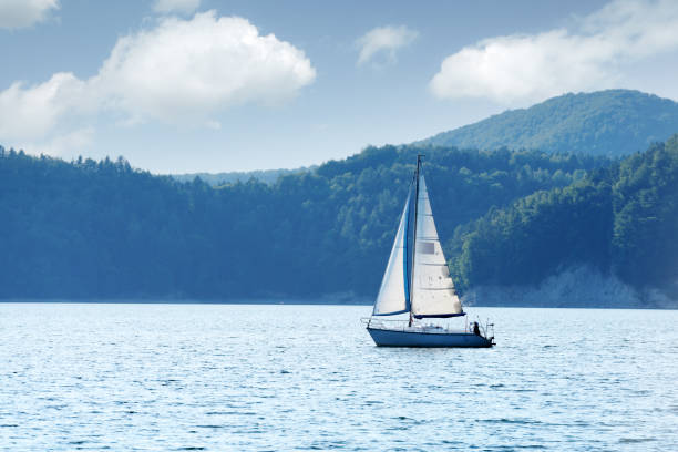 istock White yacht on Solina lake 1003130018