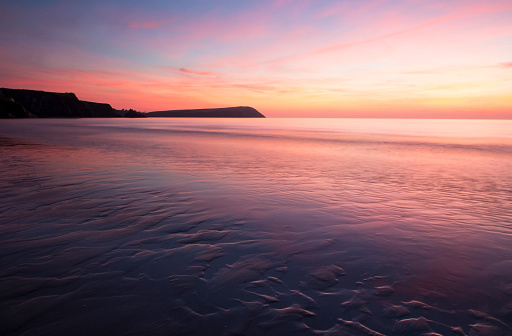 Sunset over empty beach in Pembrokeshire, Wales