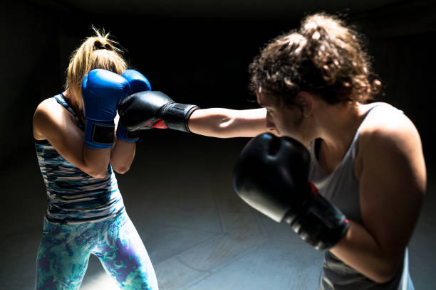 istock Two professional kick boxers sparring with each other 1003137104