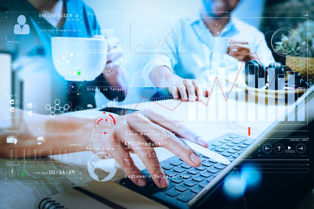 istock co working website designers working at office and holding a cup of coffee,working on smart phone and digital tablet computer docking on smart keyboard,filter film effect 1003137482