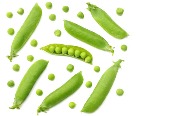 istock fresh green peas isolated on a white background. top view 1003139766