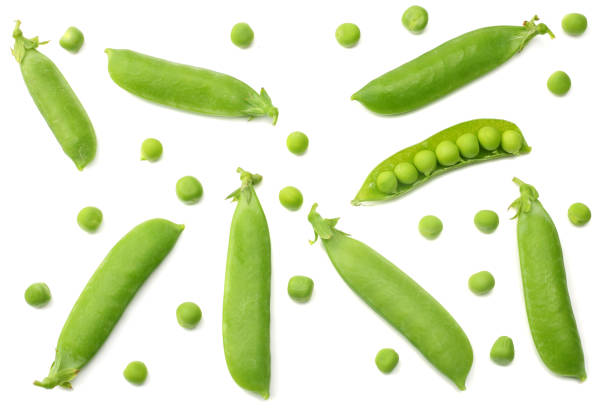 istock fresh green peas isolated on a white background. top view 1003139770