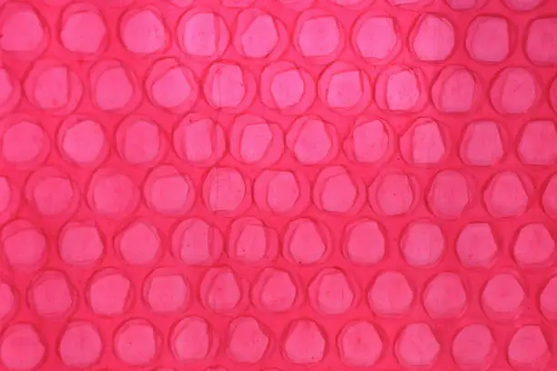 Photo of Red Bubble Wrap Close Up Abstract
