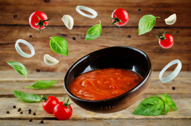 istock Marinara sauce with flying ingredients to prepare it 1003143046
