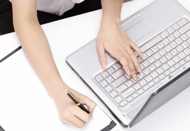 istock young woman assistant with paperwork in the office 1003143924