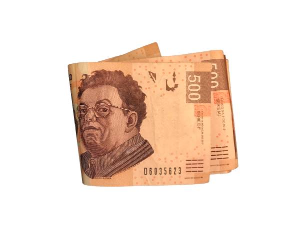 istock Some 500 mexican peso paper bills grouped and isolated on white background 1003146840