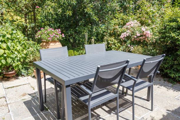 istock Flowered terrace with garden furniture 1003146890