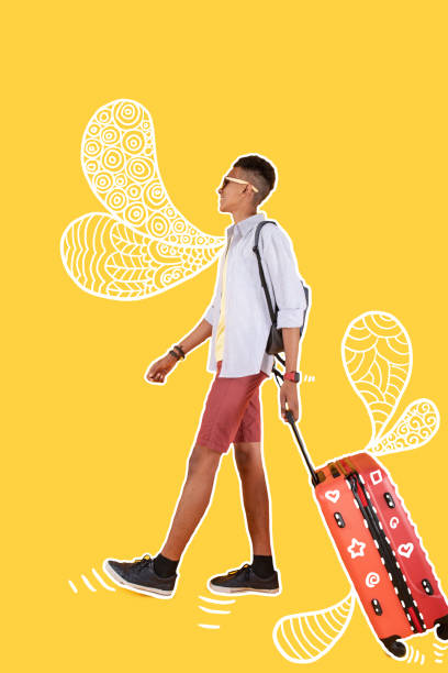 istock Relaxed tourist walking with a suitcase and looking happy 1003150016