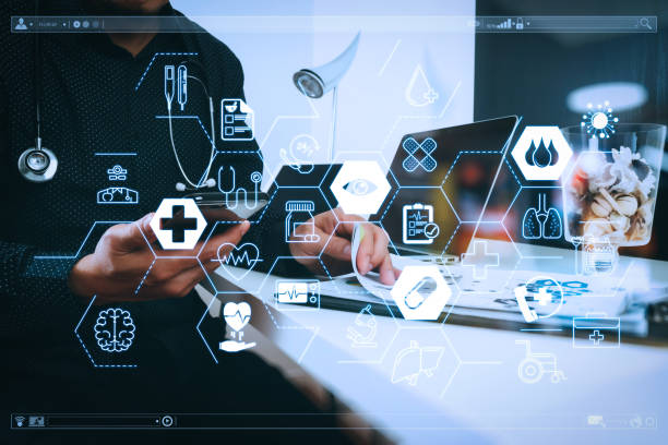 istock smart medical doctor working with smart phone and digital tablet and laptop computer and stethoscope on wood desk in modern office 1003150318