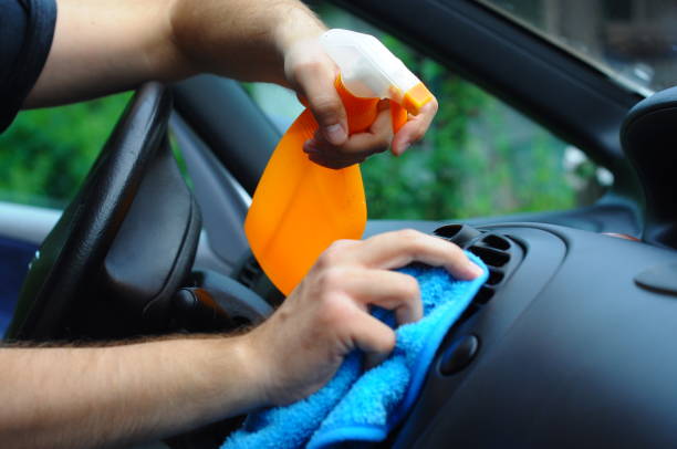istock Cleaning the car inside - Men hands clean the car 1003150346