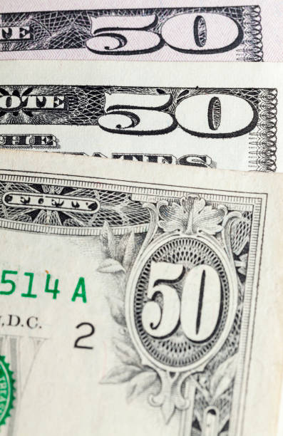 istock Dollars background fifty one 1003150726