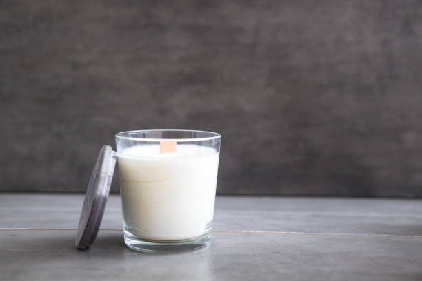 istock Concrete scented soy round candle on grey table 1003153980