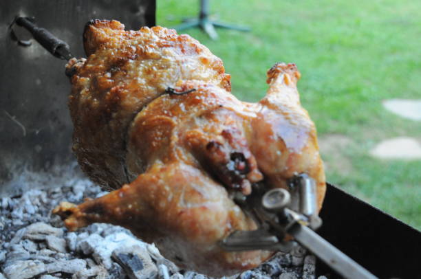 Roast Chicken on the BBQ Chicken Meat, Grilled Chicken, Barbecue Chicken, Chicken Leg, Fire - Natural Phenomenon smoking meat rotisserie barbecue grill stock pictures, royalty-free photos & images
