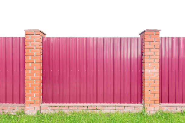 Metal fence by the grass.