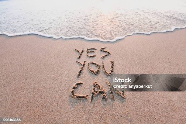 Yes You Can Motivational Inspirational Message On Sand Stock Photo - Download Image Now