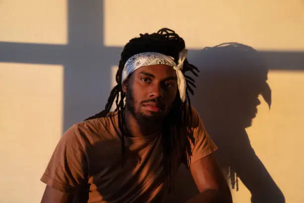 Photo of Golden light on man with bandana