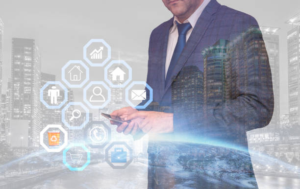 istock Double exposure of businessman holds his tablet 1003172450