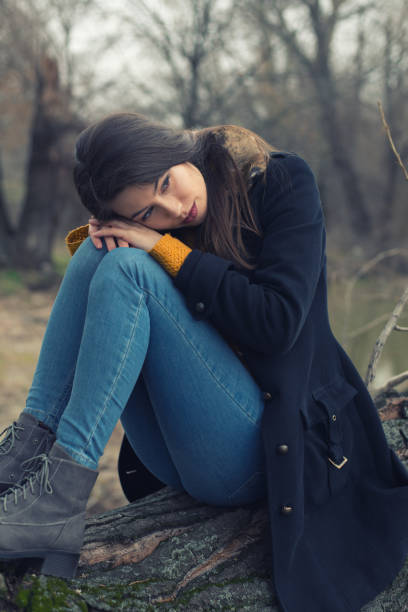 istock Sad woman in autumn nature 1003181894