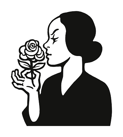 Woman Smelling a Rose