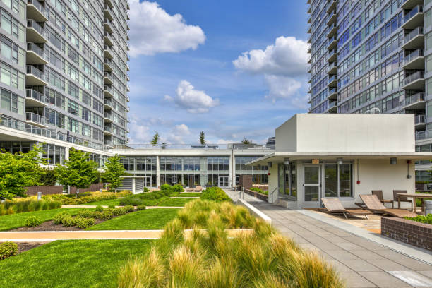 istock Luxury apartment building features open-air park. 1003193160