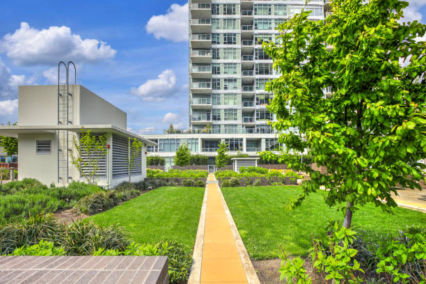 istock Luxury apartment building features open-air park. 1003196510
