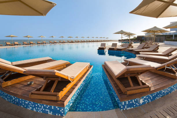 istock Hotel swimming pool, outdoor, with sunbeds around 1003203010