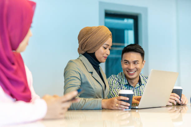 istock Asian Business People Meeting in an Open Plan Office 1003215694