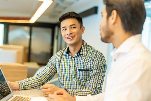 istock Casual Businessmen Having a Meeting Together With a Laptop Computer 1003215728