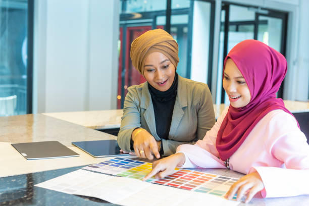 istock Professional Muslim Business Women Looking at Colour Charts 1003215744