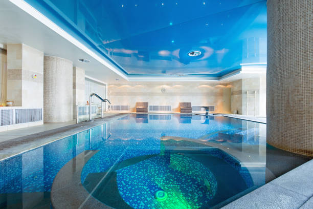 istock Indoor swimming pool in hotel spa center 1003221966