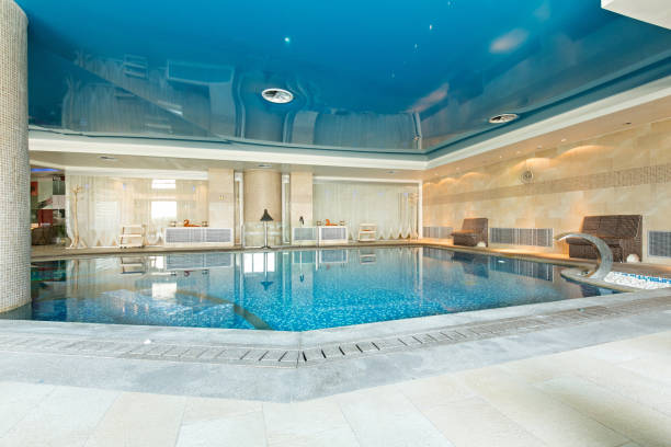 istock Indoor swimming pool in hotel spa center 1003222406