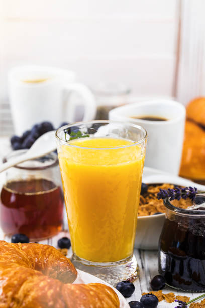 istock Breakfast with croissants, coffee, cereals and fruits 1003232376