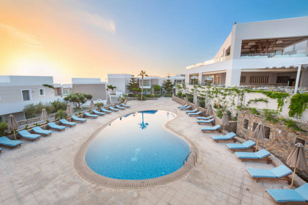 istock Hotel swimming pool, outdoor, with sunbeds around 1003234820