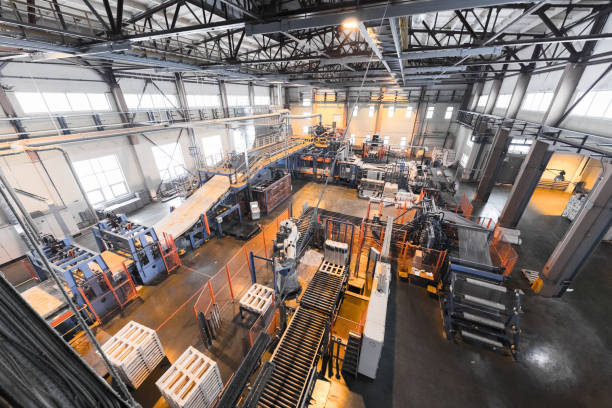 istock Factory workshop interior and machines on glass production background 1003235518