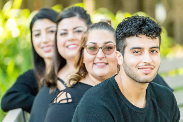 istock Group of four people hanging out together 1003236244