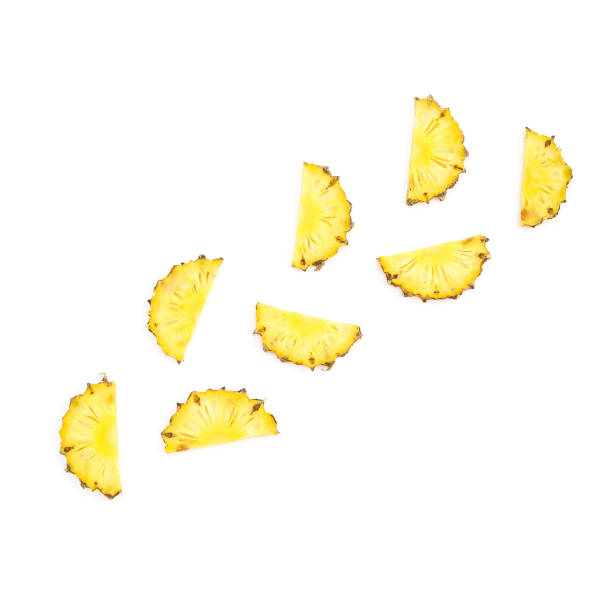 istock Sliced pineapple fruit isolated on white background. Flat lay, top view. Tropical food concept. 1003254734