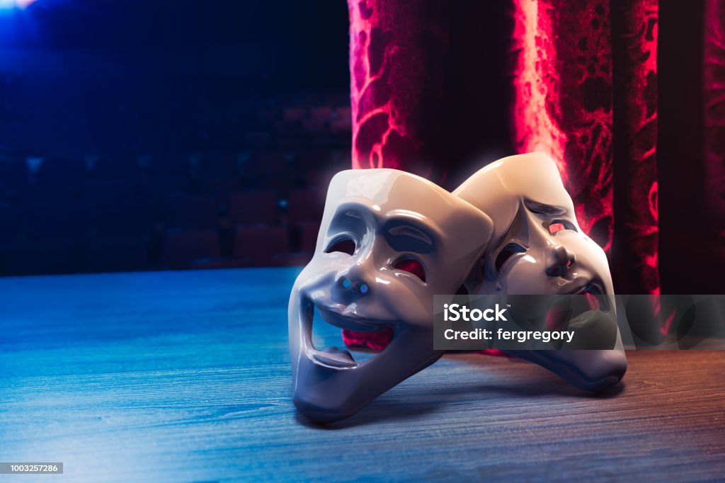 Theater masks in front of a red curtain/ 3D rendering Theater masks, drama and comedy with a red curtain as backdrop / 3D Rendering, Mixed media. Theatrical Performance Stock Photo