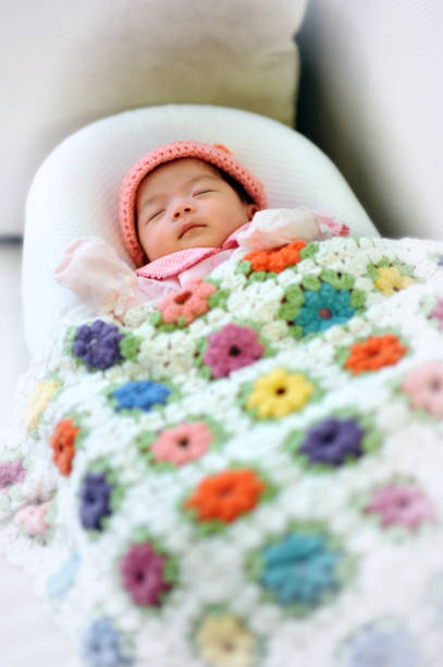 istock Sleeping cozy baby girl 1003259900