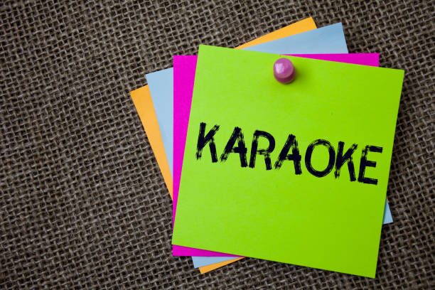 istock Handwriting text writing Karaoke. Concept meaning Entertainment singing along instrumental music played by a machine Sticky cards board pinned muliple colours remember idea jute background. 1003272220