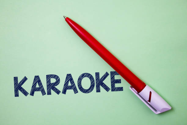 istock Handwriting text Karaoke. Concept meaning Entertainment singing along instrumental music played by a machine Ball point artwork smooth parallel lines pattern study beautiful poster. 1003278088
