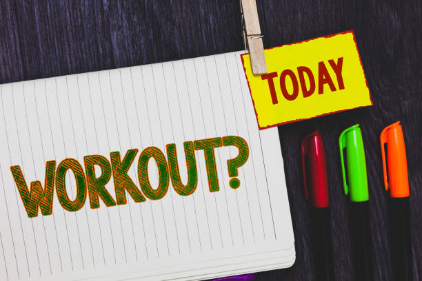 istock Handwriting text writing Workout Question. Concept meaning Activity for wellness bodybuilding training exercising Papers marker pens nice art daily creative work wood colour black shadow. 1003278180