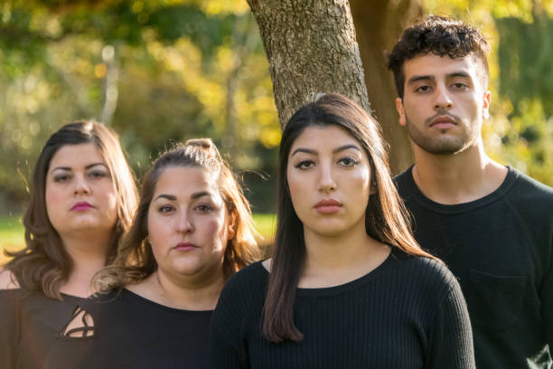 Group of four people hanging out together Group of four people (siblings, coworkers) hanging out together iranian ethnicity stock pictures, royalty-free photos & images