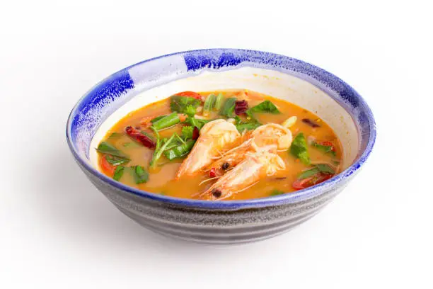 Photo of Traditional thai cuisine, Tom yum goong, Spicy shrimp soup on white background